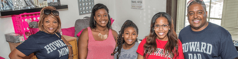Howard student smiling with family